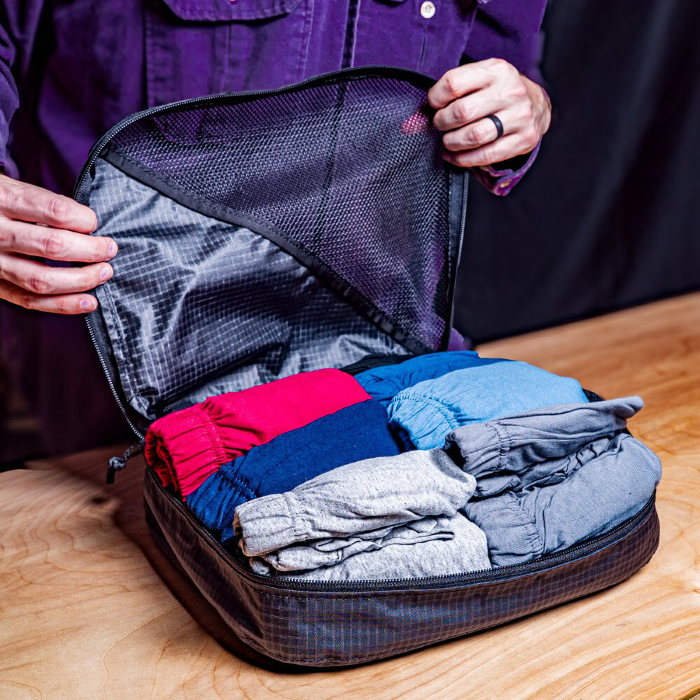 Traveler displays how many pieces of clothing fit in a packing cube